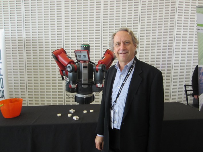 Baxter (left) with Rethink Robotics CEO Rodney Brooks.