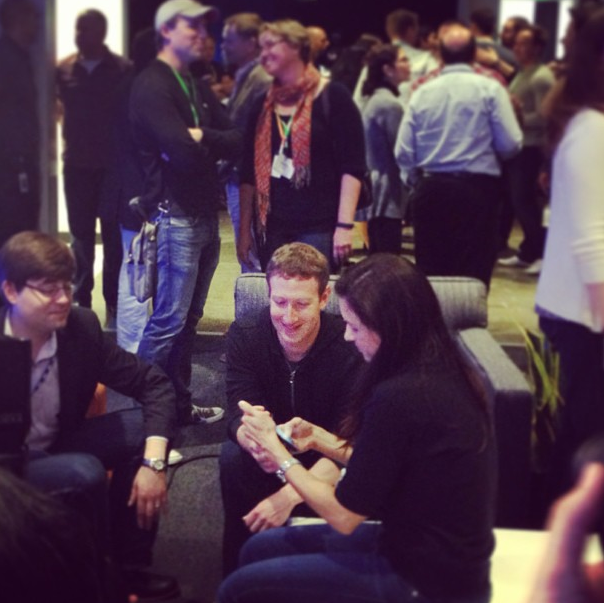 Mark Zuckerberg checks out one of the new phones with the Facebook Home at Menlo Park headquarters.