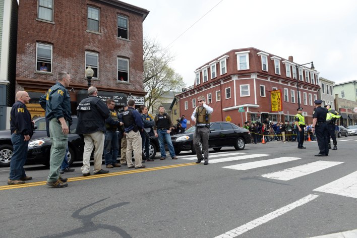 Federal agents descend on the home of a suspect-at-large in the Boston Marathon bombing. Getty Images
