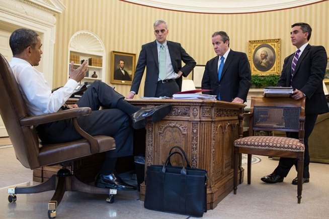 US President Obama with a Frank Clegg briefcase in Oval Office