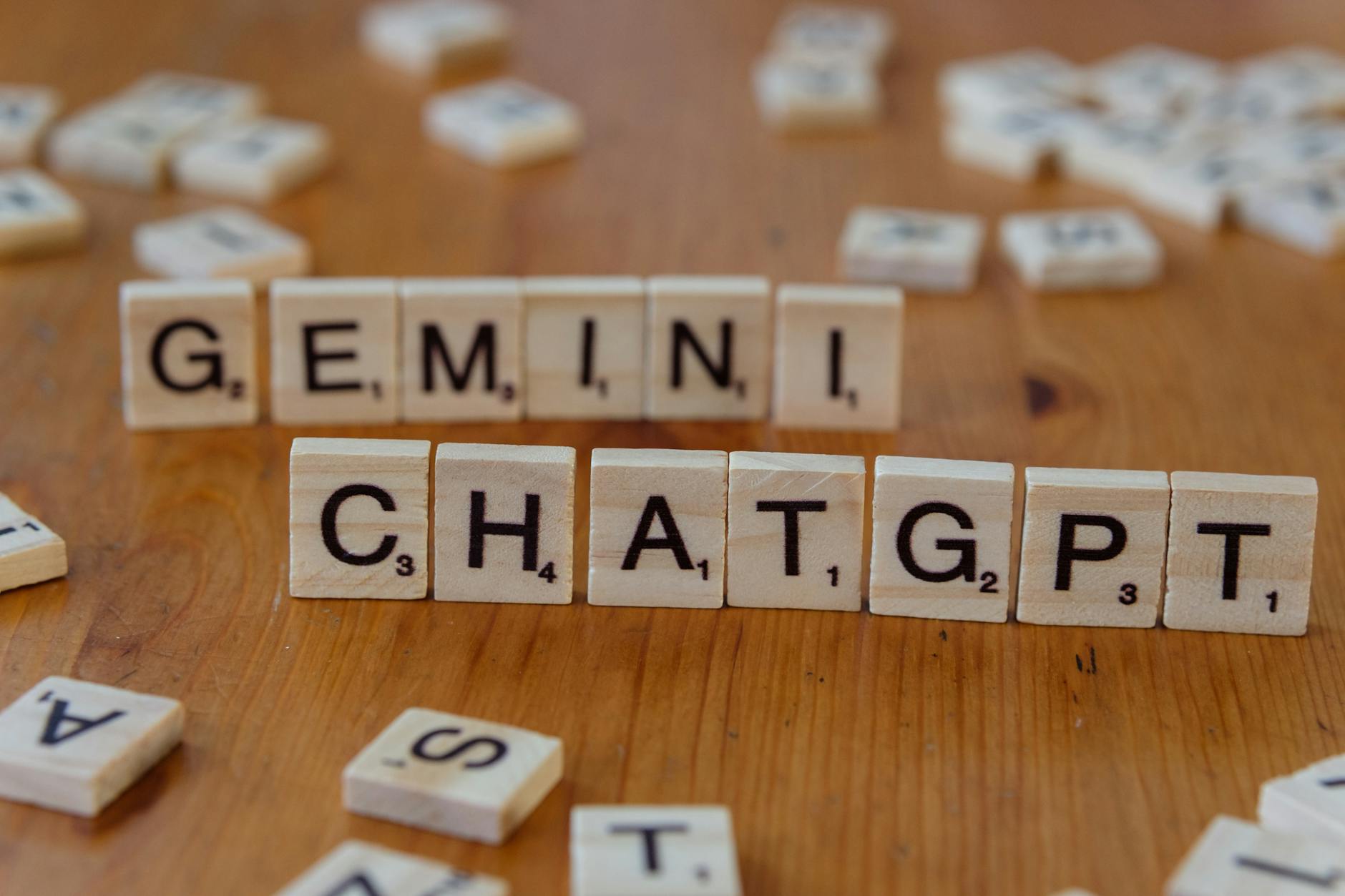 scrabble tiles spelling gemini and chatgpt